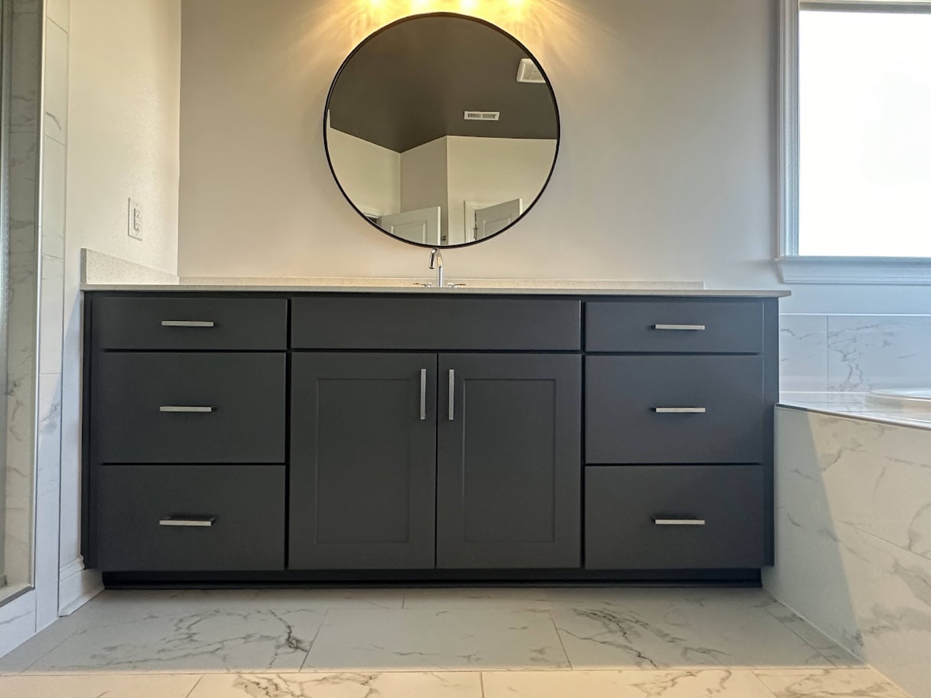 A bathroom vanity refinished in a deep, hard-wearing charcoal.