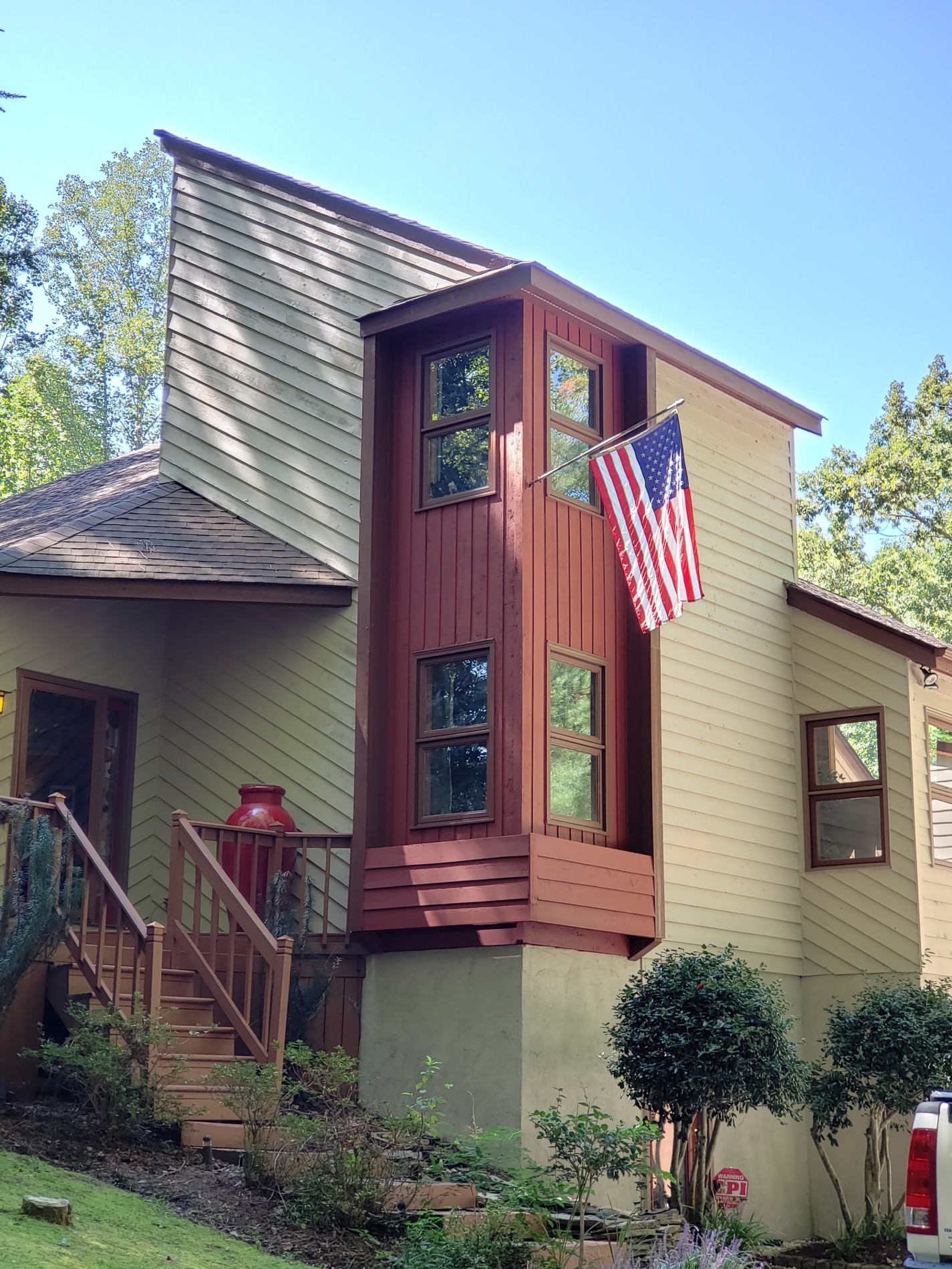 Warm exterior colors on a wooded Triangle home.